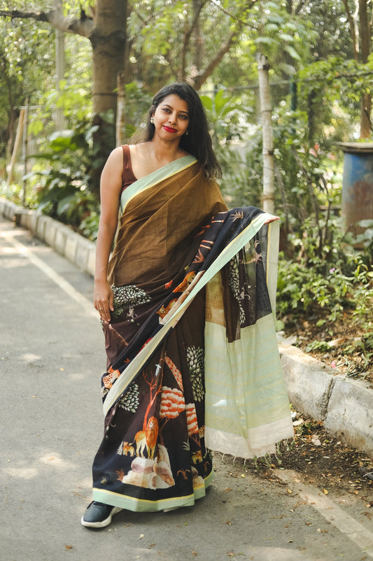 Woman wearing saree and shoes showcasing her saree