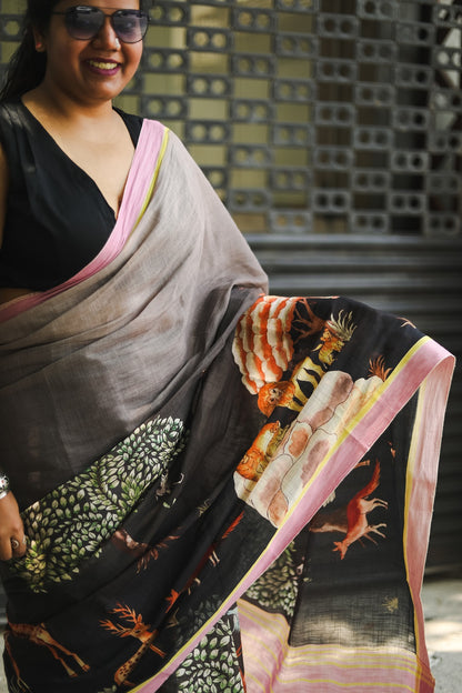 Woman in a saree showing the saree details and prints