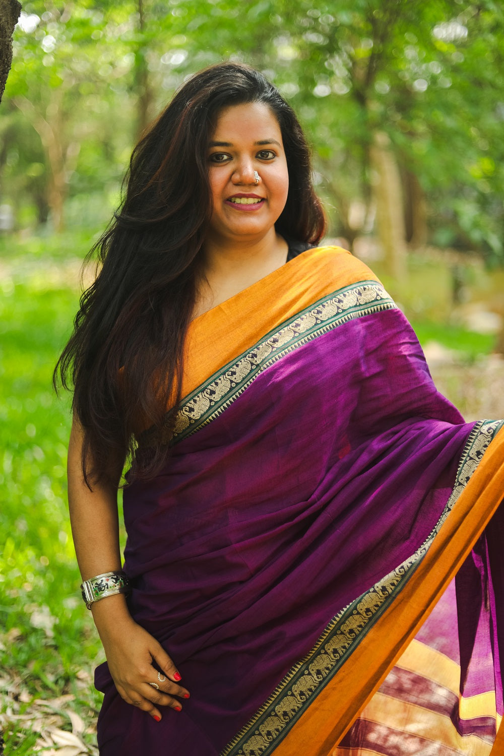 Woman in purple narayanpet handloom cotton saree close up