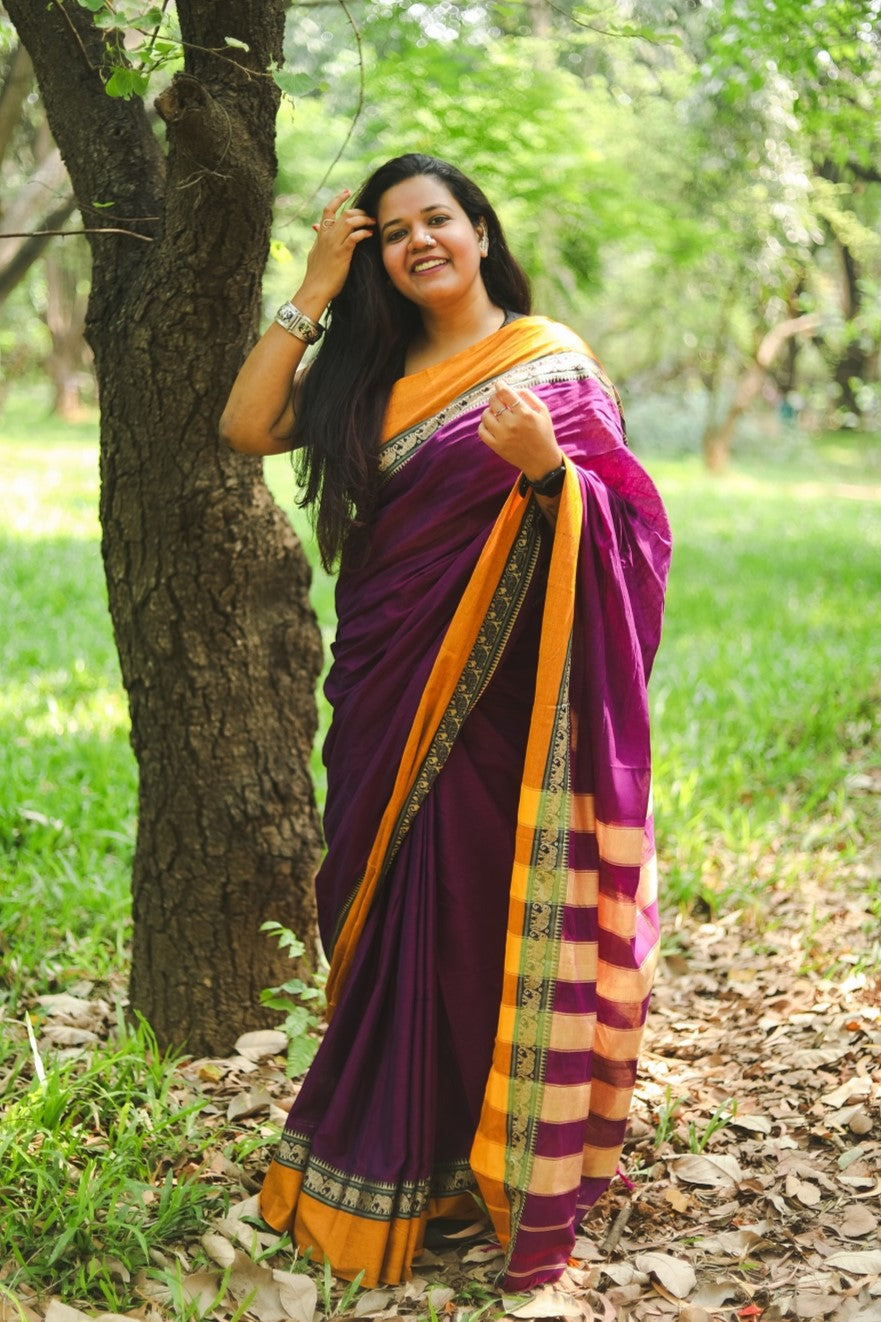 woman in a purple narayanpet handloom cotton saree