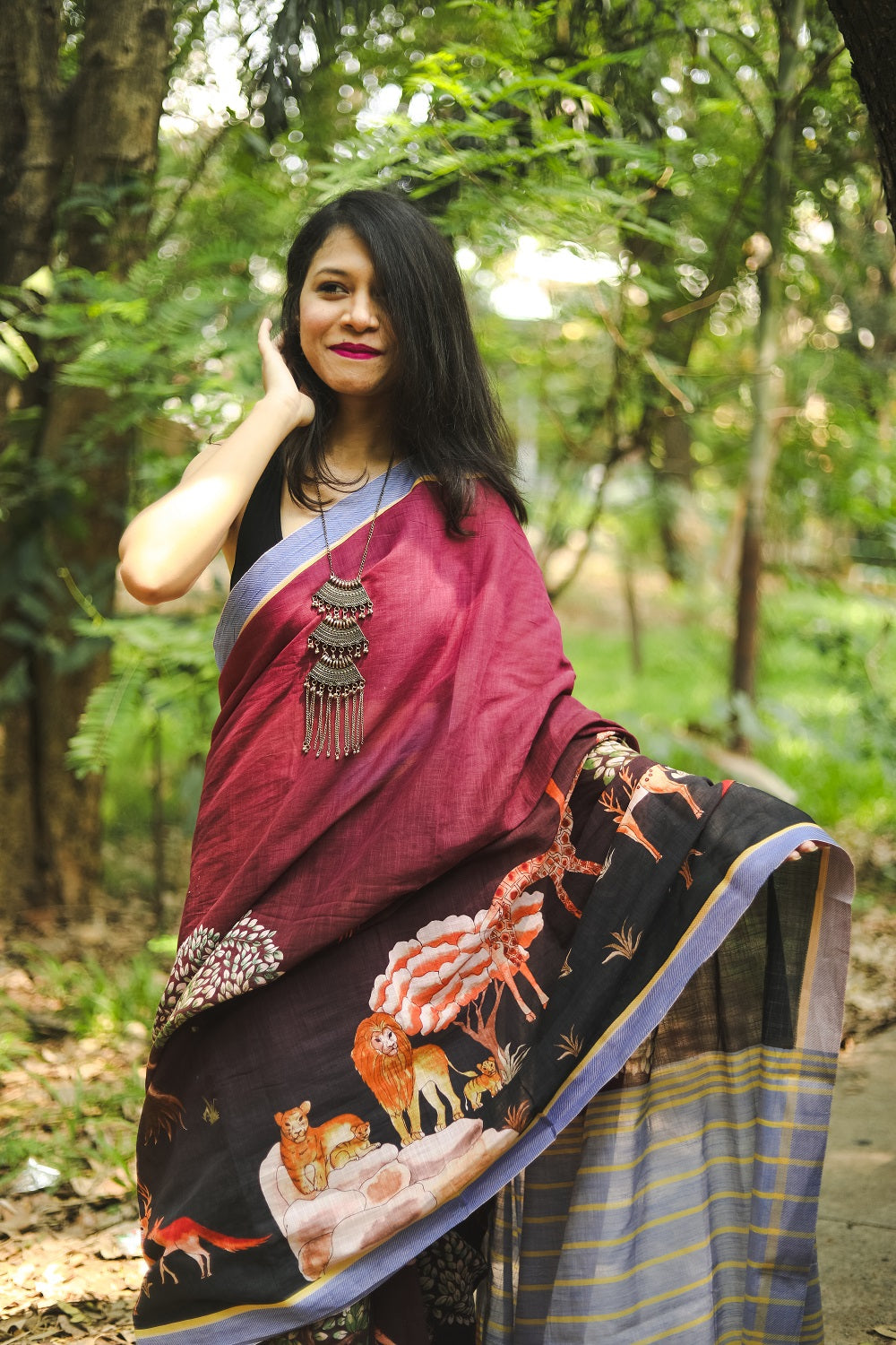 Woman in a saree adjusting her hair