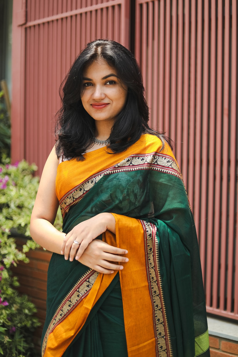 Woman in a green narayanpet handloom cotton saree portrait