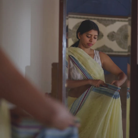 Woman getting ready in a saree