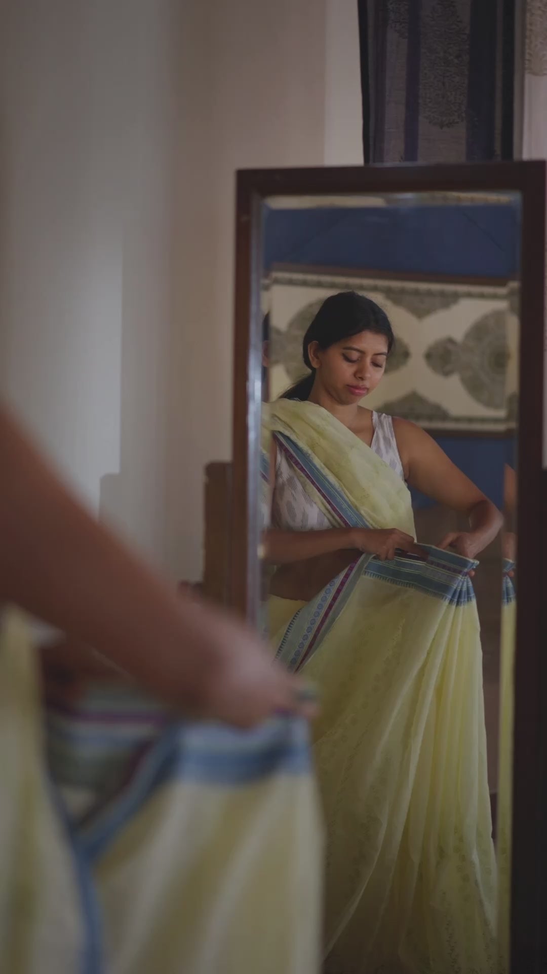 Woman getting ready in a saree